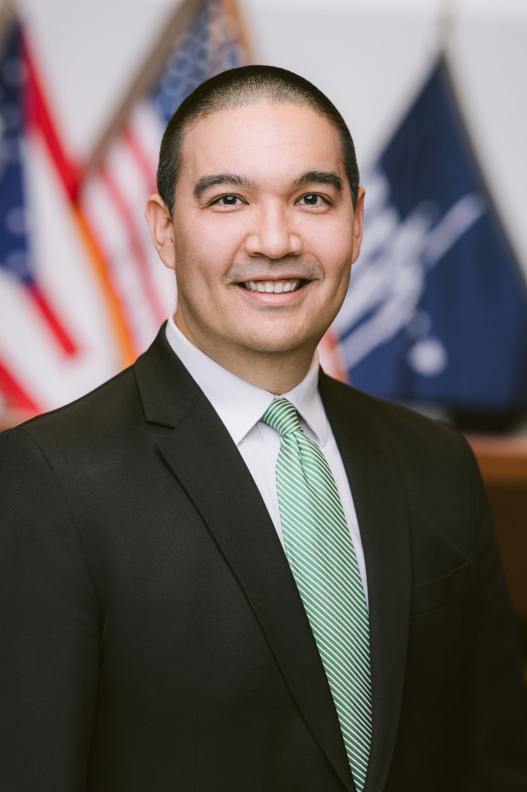 Man smiles at camera.