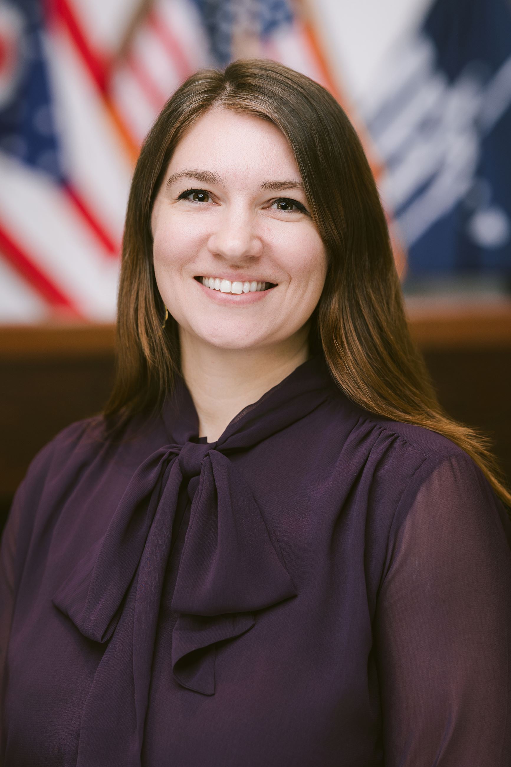 Woman smiles at camera.